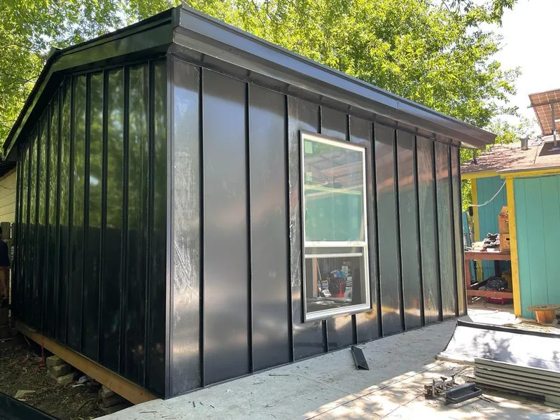 Black standing seam metal wall panels for Roof Inspection in Greer